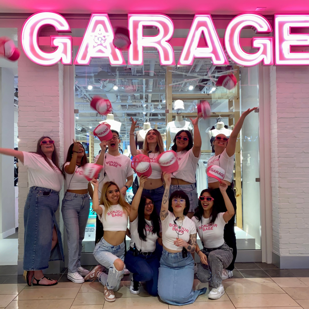 Garage team in front of the store