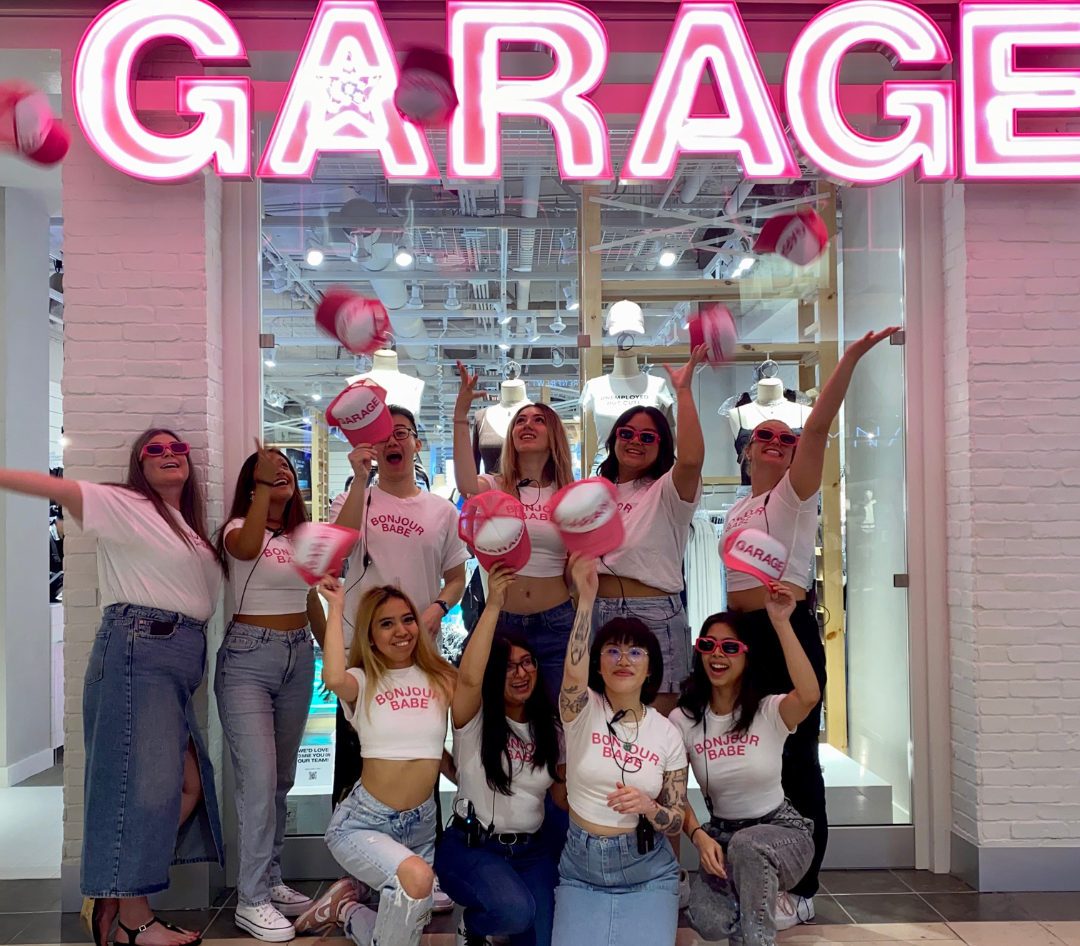 Garage team in front of the store